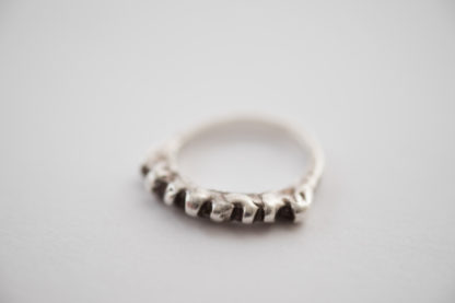 silver band ring with flame design. Good for stacking